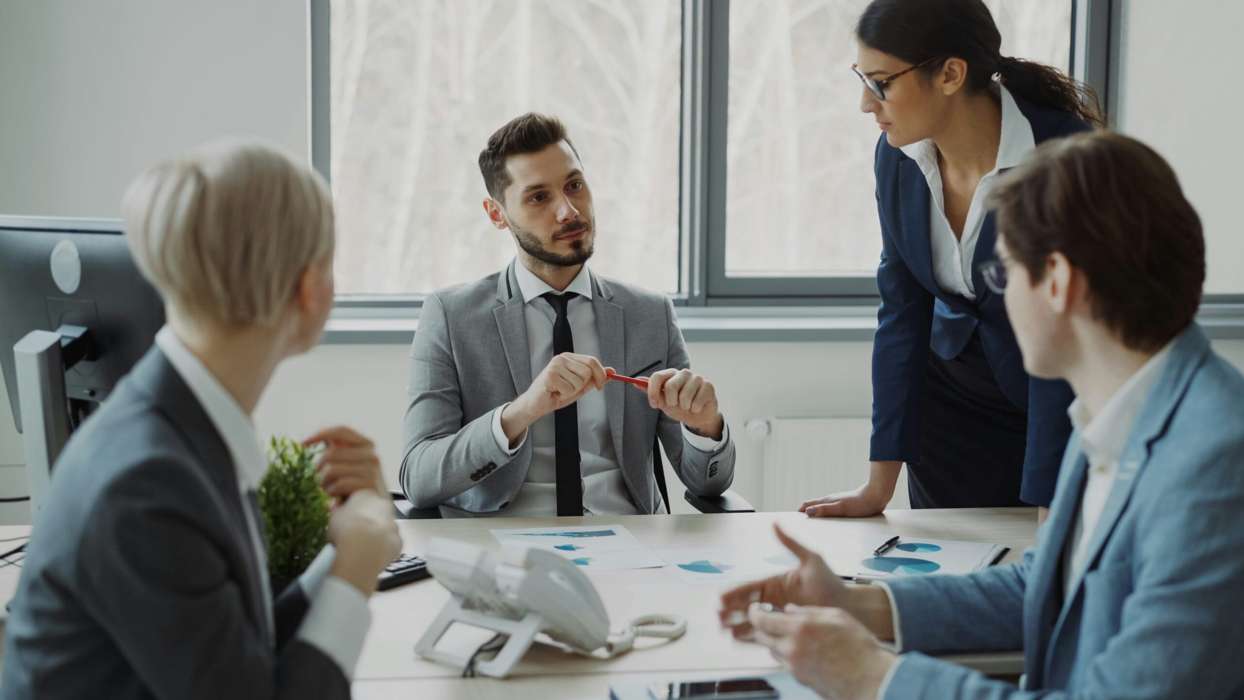 Insurance advisor speaking with a business owner during a planning consultation