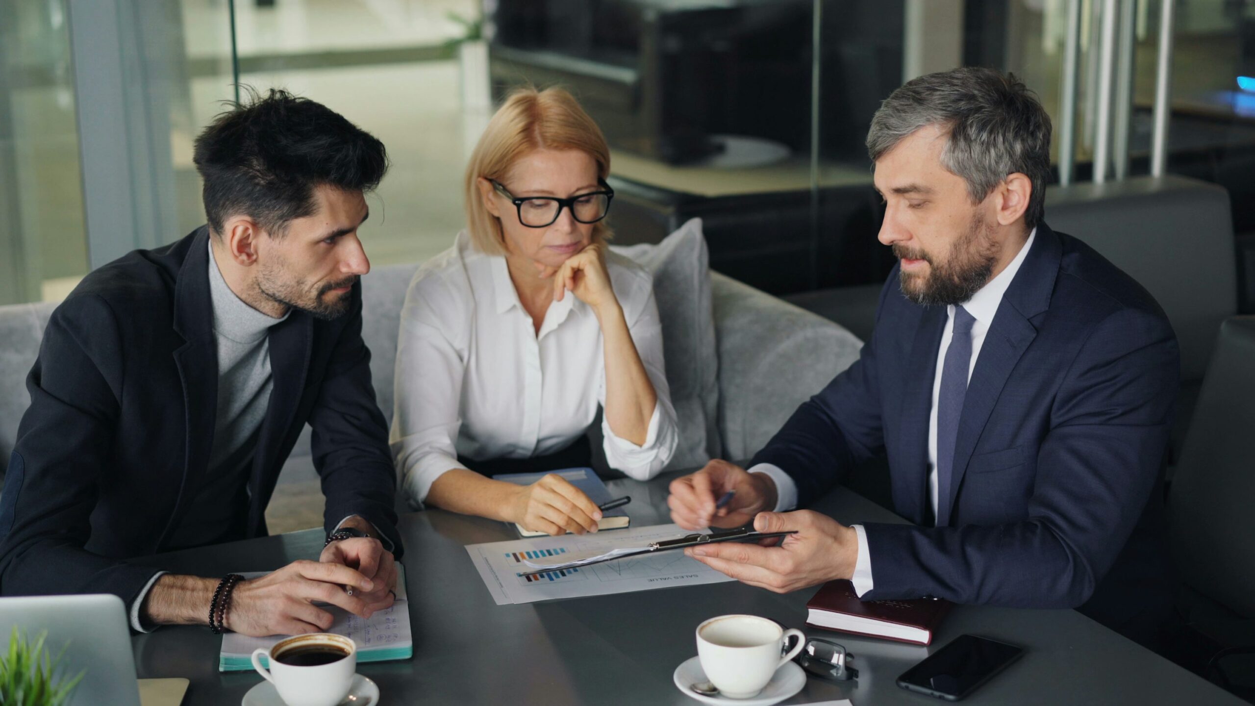 Insurance professionals reviewing coverage planning and business growth goals